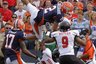 Illinois quarterback Nathan Scheelhaase (2) goes up into the air against Northern Illinois cornerback Tommy Davis (20) and Northern Illinois linebacker Devon Butler (9) during the first half of the NCAA college football game in Champaign, Ill., Saturday, Sept. 18, 2010. (AP Photo/Seth Perlman)
