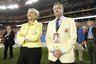 This Jan. 4, 2010 photo shows Arizona governor Jan Brewer and Fiesta Bowl CEO John Junker on the sidelines during the 2010 Fiesta Bowl college football game in Glendale, Ariz. The Fiesta Bowl has fired its longtime CEO John Junker after a scathing internal report found "an apparent scheme" to reimburse employees for political contributions.  (AP Photo/Arizona Republic, Rob Schumacher)