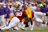 BATON ROUGE LA - NOVEMBER 06:  Quarterback Jordan Jefferson #9 of the Louisiana State University Tigers is tackled by Dont'a Hightower #30 of the Alabama Crimson Tide at Tiger Stadium on November 6 2010 in Baton Rouge Louisiana. The Tigers defeated the Crimson Tide 24-21.  (Photo by Chris Graythen/Getty Images)