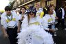Michigan cheerleaders second line in a parade through the French Quarter during festivities for the upcoming BCS Sugar Bowl NCAA college football game between Michigan and Virginia Tech in New Orleans, Monday, Jan. 2, 2012. (AP Photo/Gerald Herbert)
