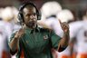 Miami coach Randy Shannon talks via his headset during the second quarter of an NCAA college football game against Florida State, Monday, Sept. 7, 2009, in Tallahassee, Fla. (AP Photo/Phil Coale)