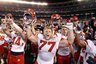 Utah football players celebrate after a 37-27 victory over California in the Poinsettia Bowl NCAA college football game Wednesday, Dec. 23, 2009, in San Diego. (AP Photo/Denis Poroy)