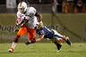 PITTSBURGH - SEPTEMBER 23:  Lamar Miller #6 of the Miami Hurricanes runs through an attempted tackle by Jarred Holley #18 of the Pittsburgh Panthers on September 23 2010 at Heinz Field in Pittsburgh Pennsylvania.  (Photo by Jared Wickerham/Getty Images)