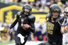 EUGENE OR - NOVEMBER 6: Quarterback Darron Thomas #1 of the Oregon Ducks runs toward the end zone and a touchdown in the second quarter of the game against the Washington Huskies at Autzen Stadium on November 6 2010 in Eugene Oregon. (Photo by Steve Dykes/Getty Images)