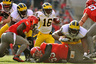 COLUMBUS OH - Quarterback Denard Robinson #16 of the Michigan Wolverines looks for running room against the Ohio State Buckeyes at Ohio Stadium in Columbus Ohio.  (Photo by Jamie Sabau/Getty Images)