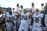 STATE COLLEGE PA - NOVEMBER 27: Safety Jesse Johnson #26 of the Michigan State Spartans and his teammates celebrate their Big Ten championship after a game against the Penn State Nittany Lions on November 27 2010 at Beaver Stadium in State College Pennsylvania. The Spartans won 28-22. (Photo by Hunter Martin/Getty Images)
