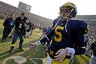 Michigan quarterback Tate Forcier (5) walks off the Michigan Stadium field after an NCAA college football game against Ohio State, Saturday, Nov. 21, 2009, in Ann Arbor. Forcier had four interceptions and Ohio State won 21-10. (AP Photo/Tony Ding)